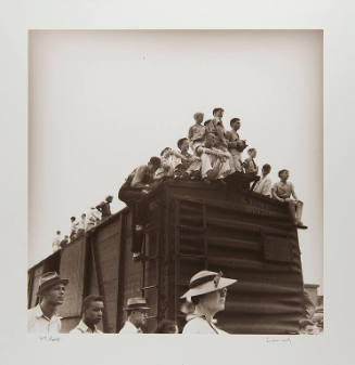 Here it Comes! Crowd on a boxcar, watching a circus being unloaded (Jackson)